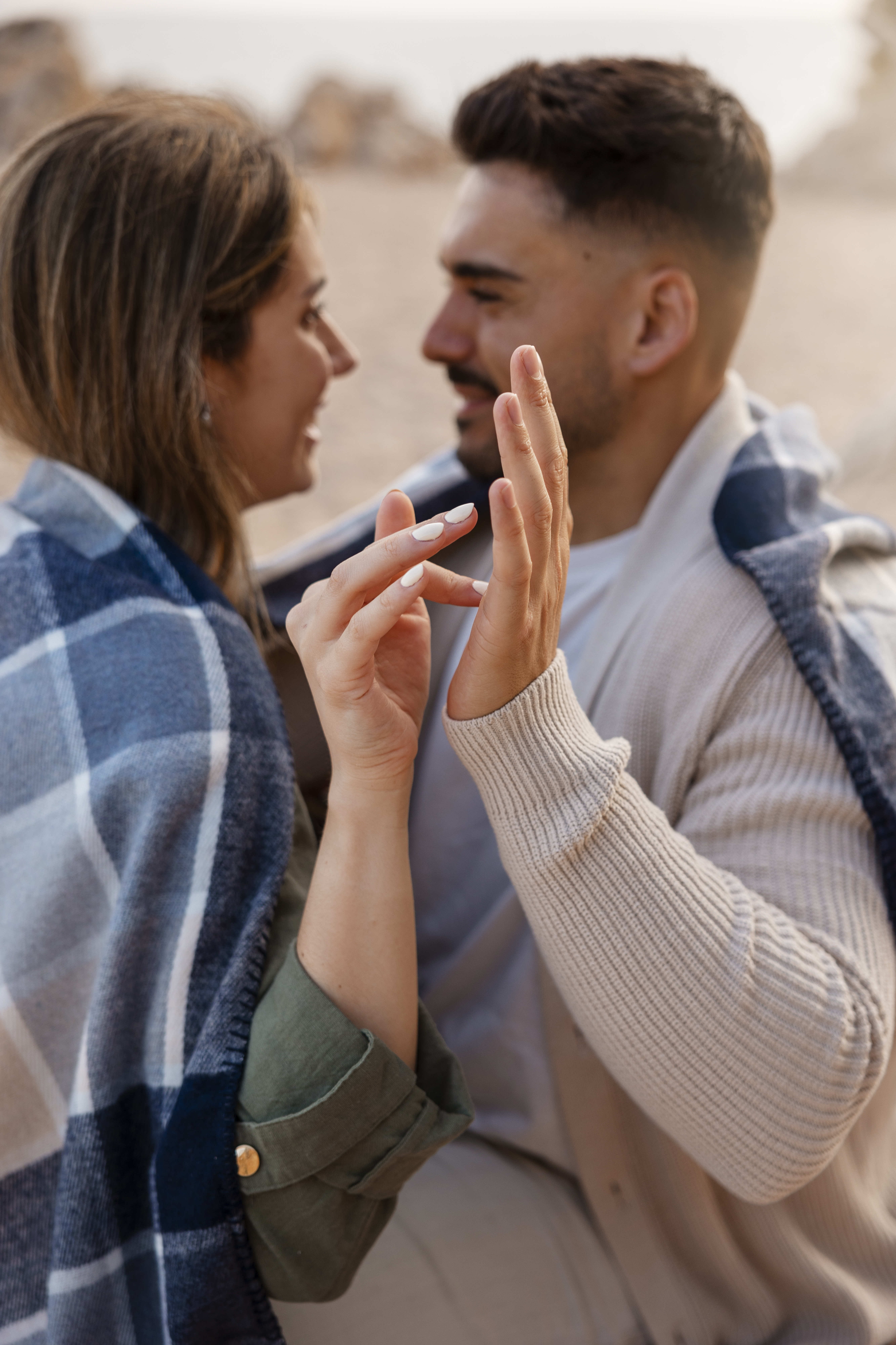 Happy couple showing engagement ring - representing successful dating and relationships
